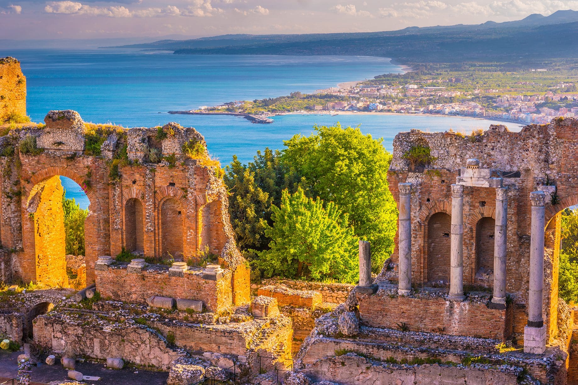 View of the Amphitheater Ruins and the Bay in Taormina Sicily