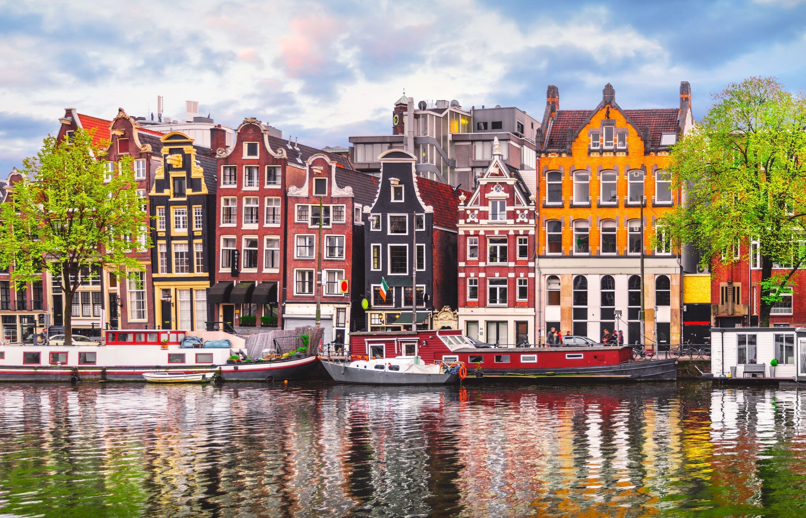 Amsterdam Old Merchants Houses, boat houses and canal in the Netherlands