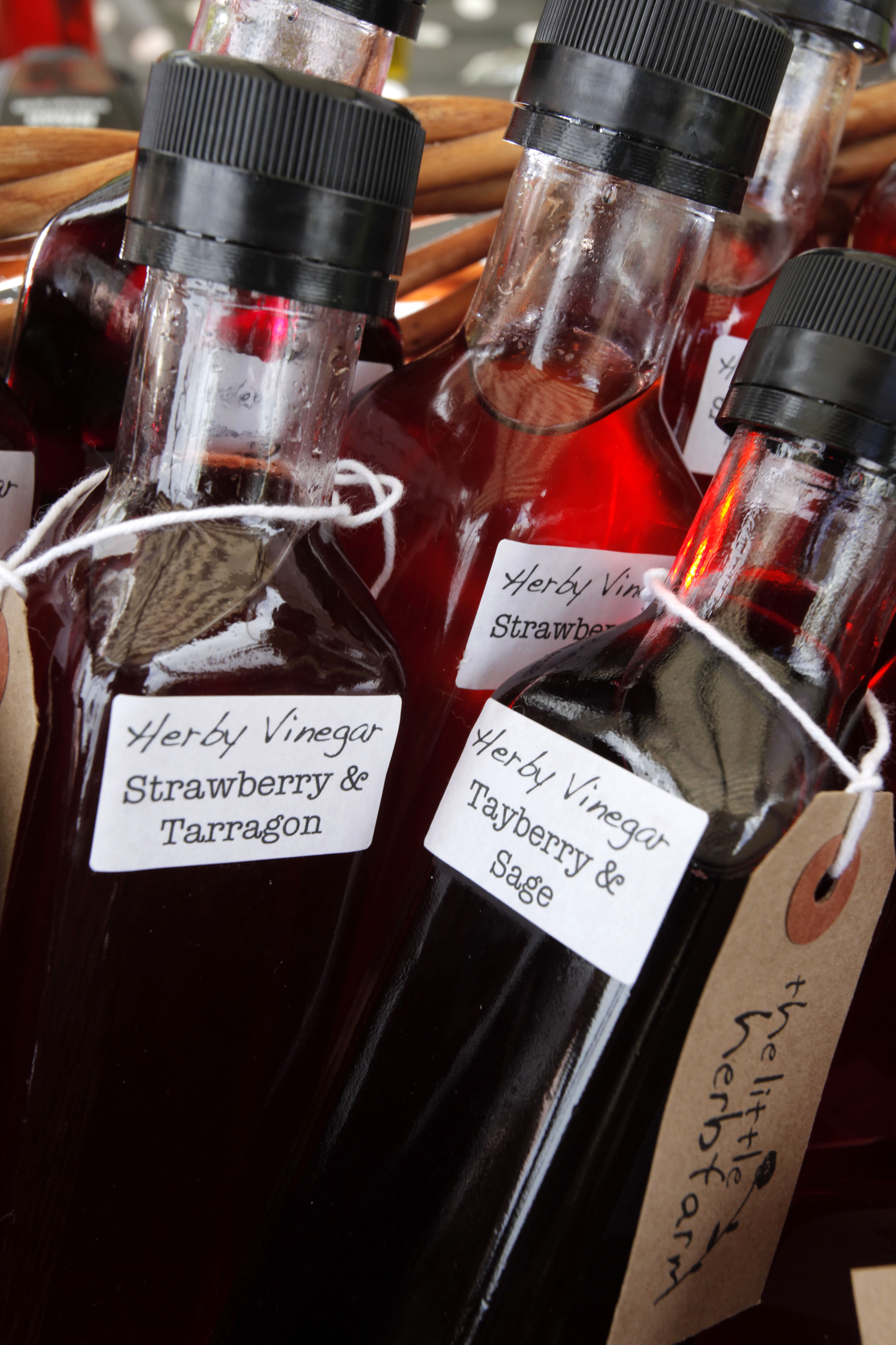 Bottles of Herby Vinegar for sale on the Little Herb Farm stall at the St Andrews Farmers' Market (held on the first Saturday of every month - except January), St Andrews, Fife